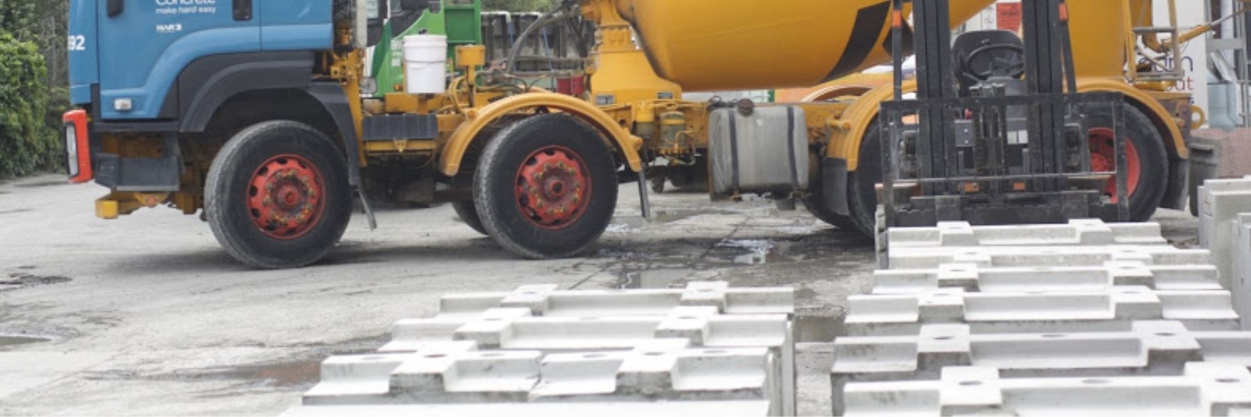 Allied Concrete Truck Reversing into Envirocon Penrose Truck Delivering Wet Concrete For New Blocks