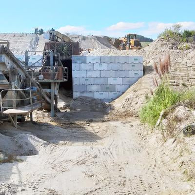 Large retaining wall made of Interbloc concrete blocks at Atiamuri Quarry
