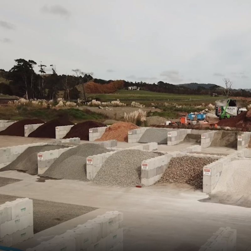 Interbloc concrete blocks forming bins to store landscape supplies