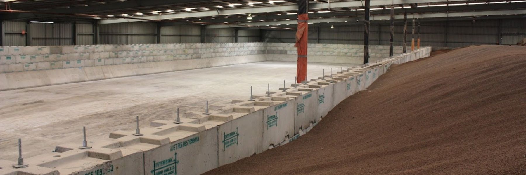 Interbloc concrete blocks forming bulk fertiliser bunkers