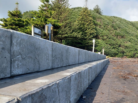 Side profile view of the Stonebloc seawall with tiered seating at Opunake Beach for South Taranaki District Council